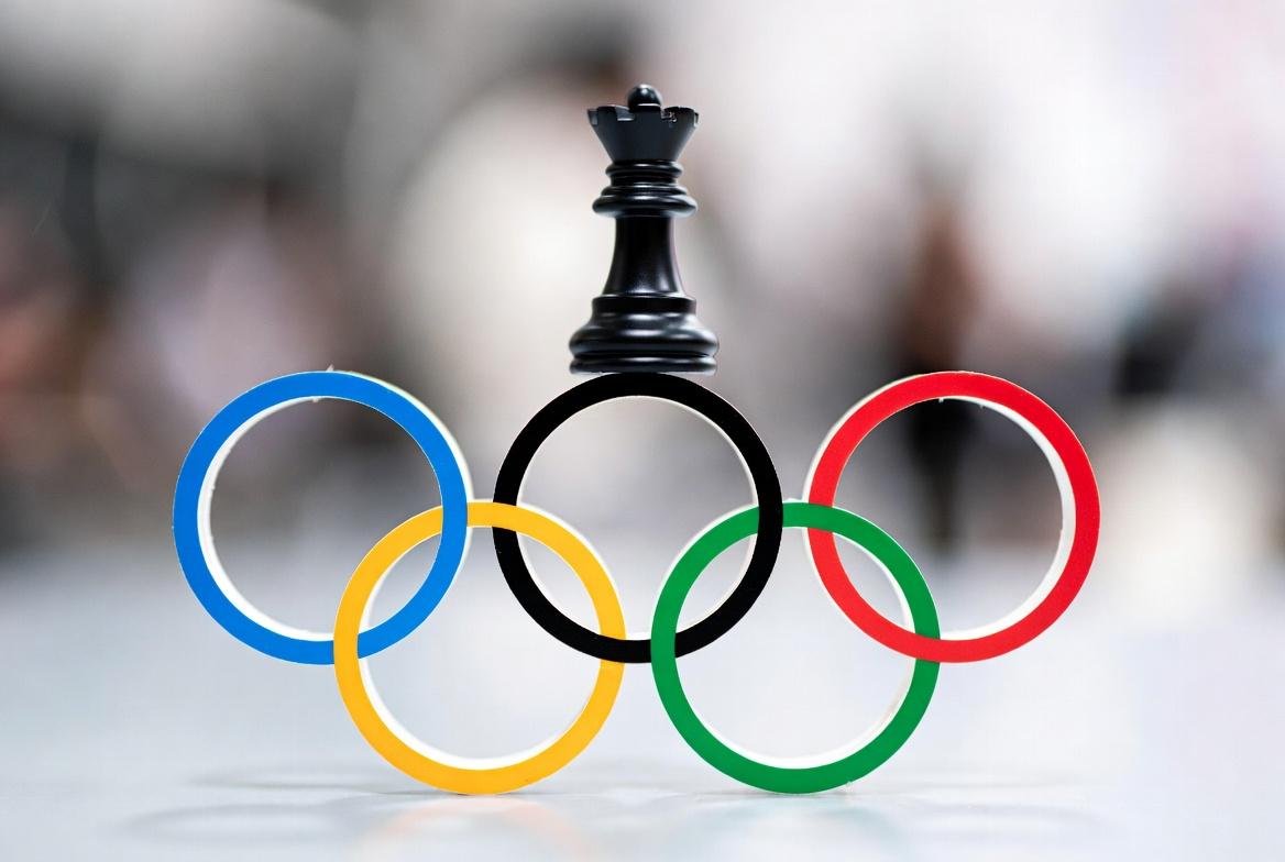 Image alt text: Intense chess match at Olympics with masterful players in strategic moment.